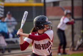Image shows softball player getting ready to hit the ball.
